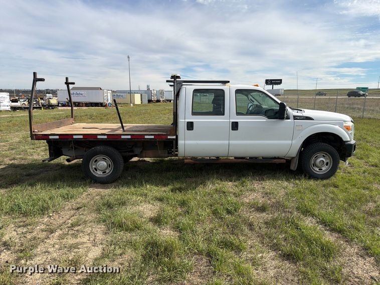 image for item FT6835 2012 Ford F350 Super Duty Crew Cab dump flatbed pickup truck