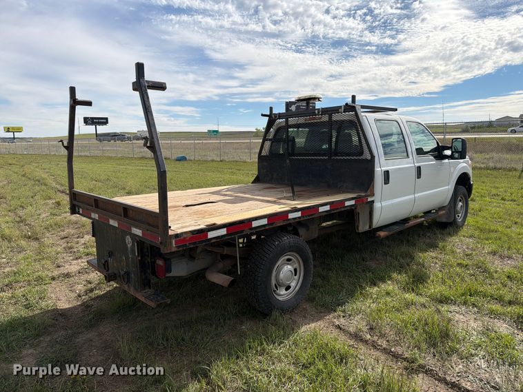 image for item FT6835 2012 Ford F350 Super Duty Crew Cab dump flatbed pickup truck