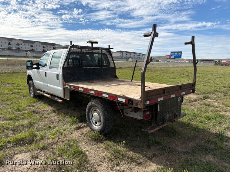 image for item FT6835 2012 Ford F350 Super Duty Crew Cab dump flatbed pickup truck