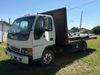 1999 Isuzu NPR flatbed truck