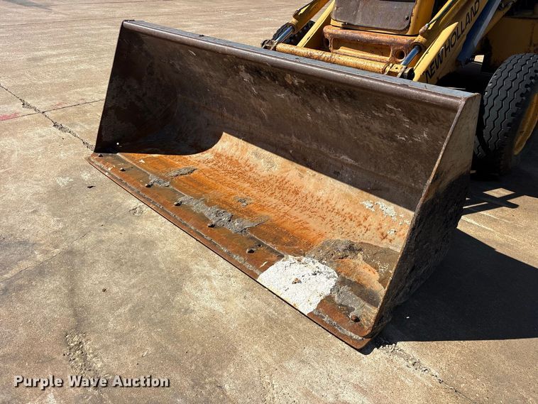 image for item ES8216 1999 New Holland 655E backhoe