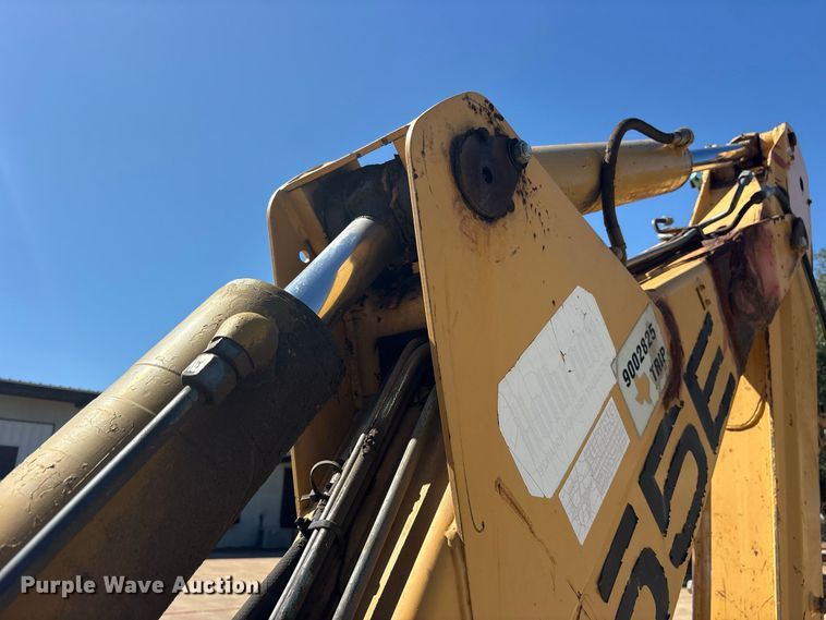 image for item ES8216 1999 New Holland 655E backhoe