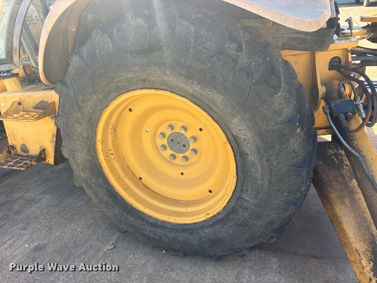 image for item ES8216 1999 New Holland 655E backhoe