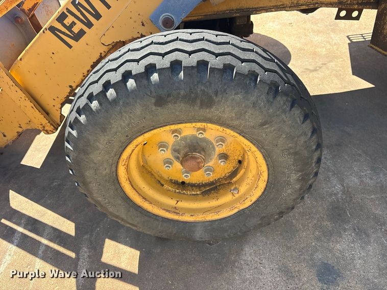 image for item ES8216 1999 New Holland 655E backhoe