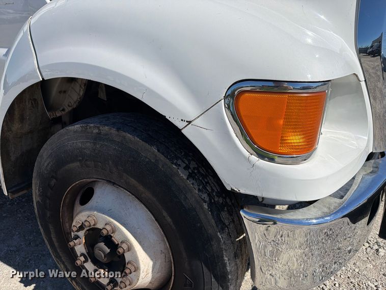 image for item YA3708 2015 Ford  F750 Super Duty Ext. Cab chipper truck