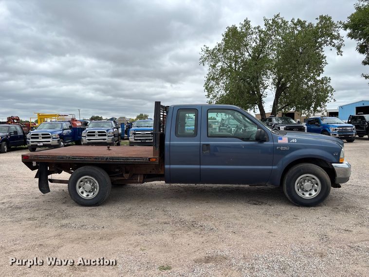 image for item FK3736 2004 Ford F250 XLT Ext cab flatbed pickup truck
