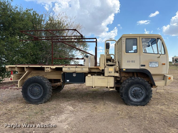 image for item FN3655 2004 Stewart & Stevenson 4X4 flatbed truck