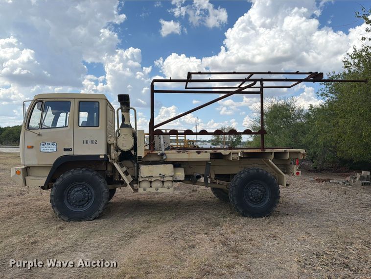 image for item FN3655 2004 Stewart & Stevenson 4X4 flatbed truck
