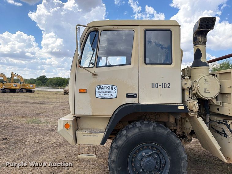 image for item FN3655 2004 Stewart & Stevenson 4X4 flatbed truck