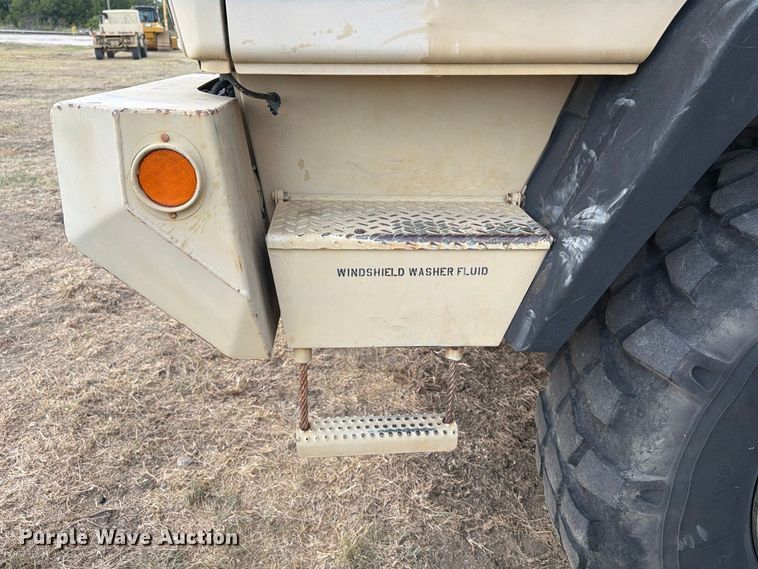 image for item FN3655 2004 Stewart & Stevenson 4X4 flatbed truck