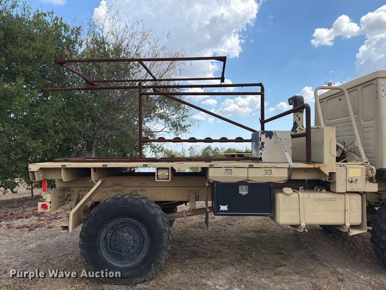 image for item FN3655 2004 Stewart & Stevenson 4X4 flatbed truck
