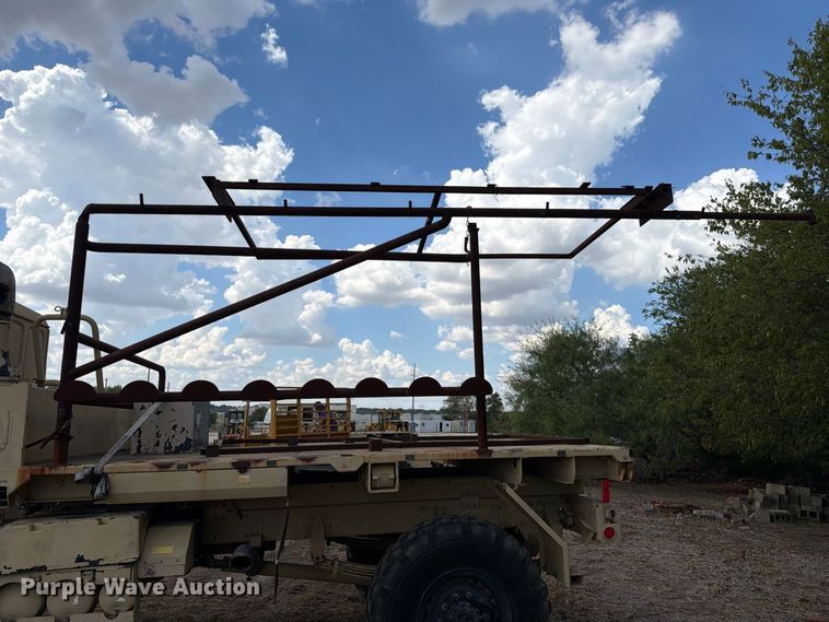 image for item FN3655 2004 Stewart & Stevenson 4X4 flatbed truck