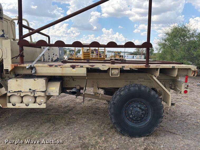 image for item FN3655 2004 Stewart & Stevenson 4X4 flatbed truck