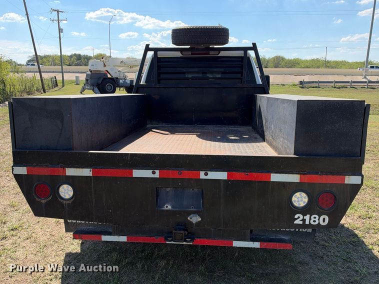 image for item FN3741 2021 GMC Sierra 3500 4X4 Crew Cab flatbed pickup truck