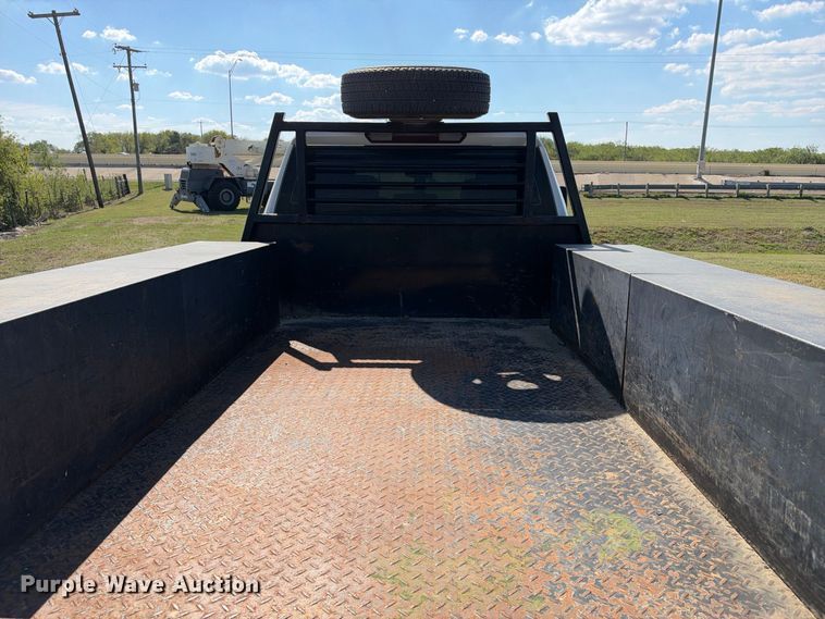 image for item FN3741 2021 GMC Sierra 3500 4X4 Crew Cab flatbed pickup truck