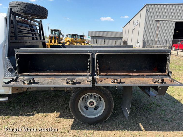 image for item FN3741 2021 GMC Sierra 3500 4X4 Crew Cab flatbed pickup truck