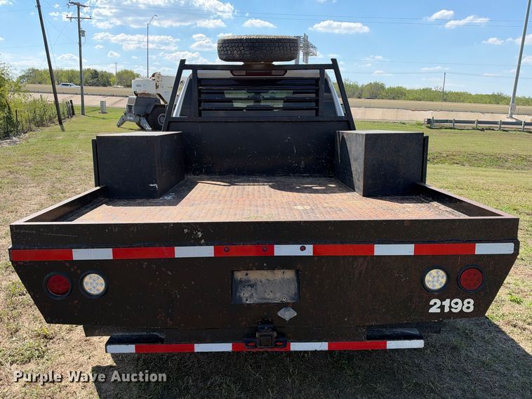 image for item FN3742 2021 GMC Sierra 3500 4X4 Crew Cab flatbed pickup truck