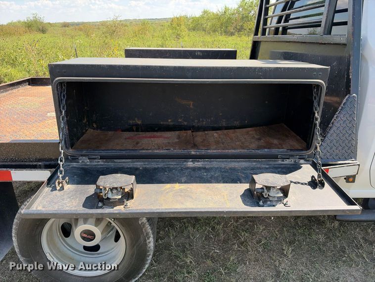 image for item FN3742 2021 GMC Sierra 3500 4X4 Crew Cab flatbed pickup truck