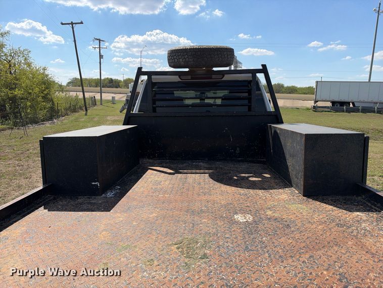 image for item FN3742 2021 GMC Sierra 3500 4X4 Crew Cab flatbed pickup truck