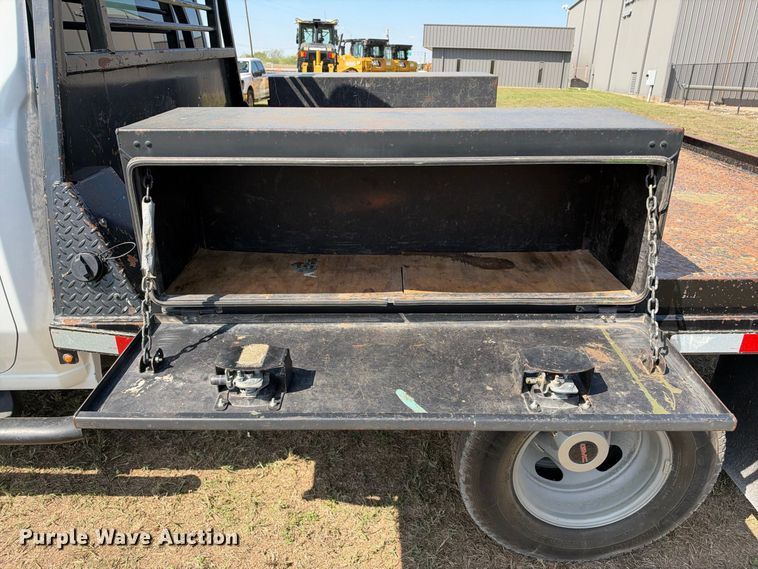 image for item FN3742 2021 GMC Sierra 3500 4X4 Crew Cab flatbed pickup truck
