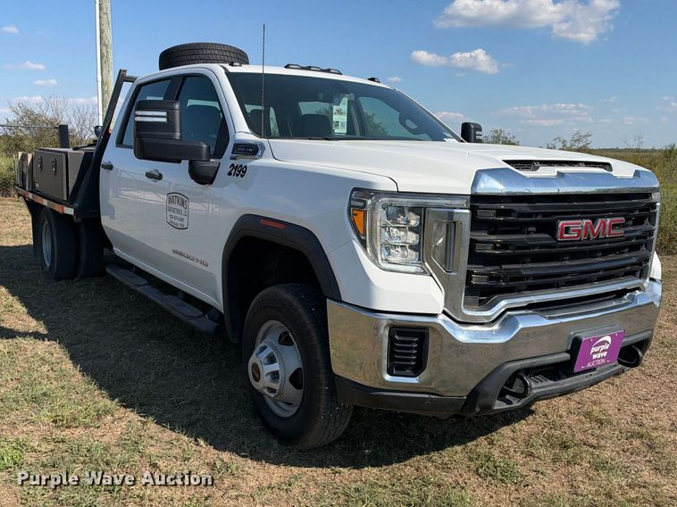 image for item FN3744 2021 GMC Sierra 3500 4X4 Crew Cab flatbed pickup truck