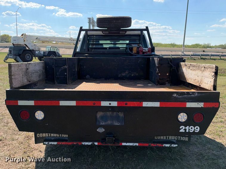 image for item FN3744 2021 GMC Sierra 3500 4X4 Crew Cab flatbed pickup truck