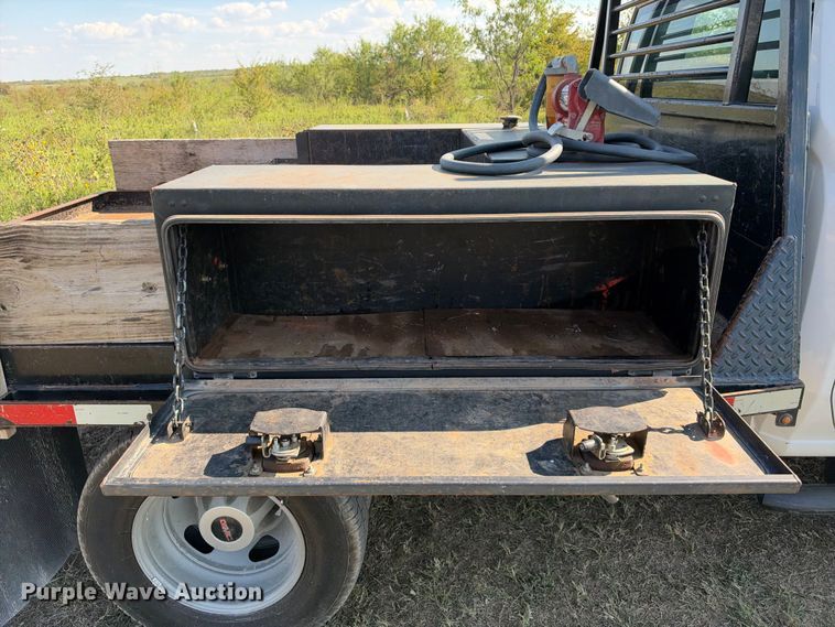 image for item FN3744 2021 GMC Sierra 3500 4X4 Crew Cab flatbed pickup truck