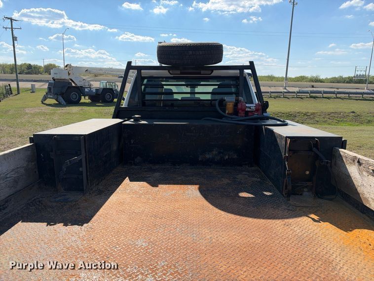 image for item FN3744 2021 GMC Sierra 3500 4X4 Crew Cab flatbed pickup truck