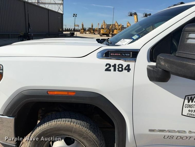 image for item FN3749 2021 GMC Sierra 3500HD 4X4 Crew Cab flatbed pickup truck