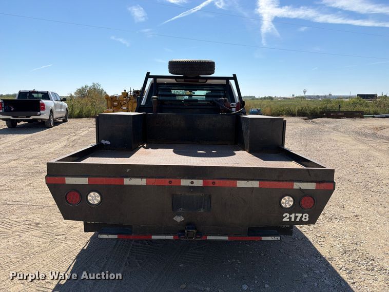 image for item FN3750 2021 GMC Sierra 3500HD 4X4 Crew Cab flatbed pickup truck