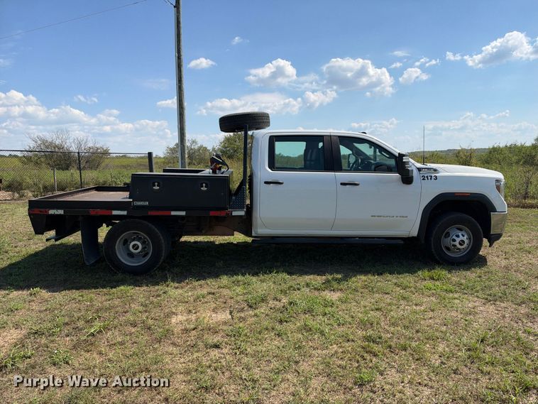 image for item FN3757 2021 GMC Sierra 3500 4X4 Crew Cab flatbed pickup truck