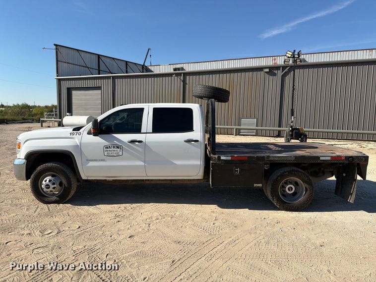 image for item FN3833 2019 GMC Sierra 3500HD 4X4 Crew Cab flatbed pickup truck