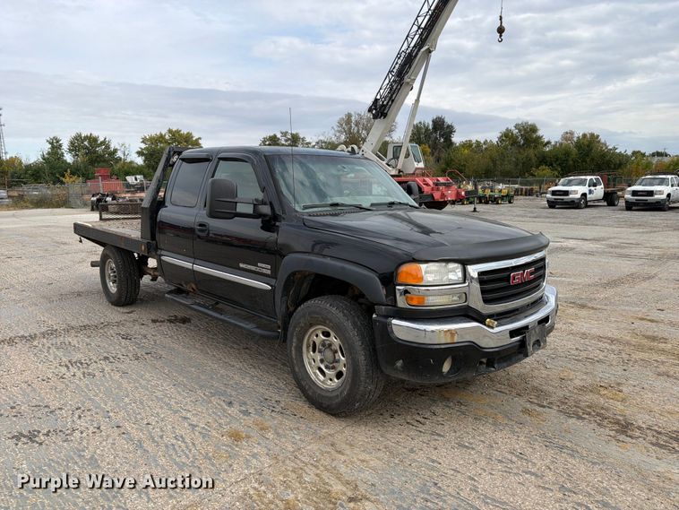 image for item EV7019 2006 GMC Sierra 2500HD Ext. Cab dump flatbed pickup truck