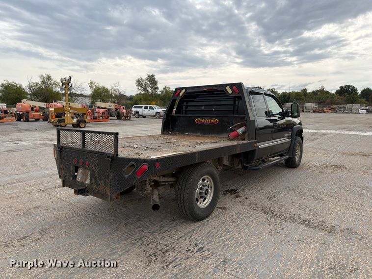 image for item EV7019 2006 GMC Sierra 2500HD Ext. Cab dump flatbed pickup truck