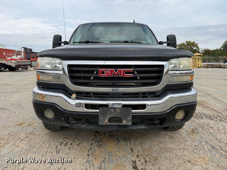 image for item EV7019 2006 GMC Sierra 2500HD Ext. Cab dump flatbed pickup truck