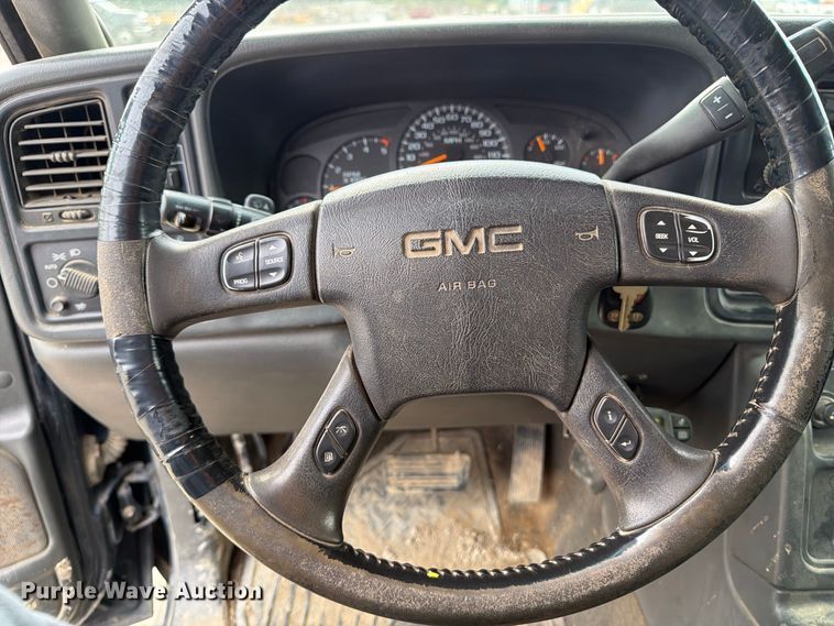 image for item EV7019 2006 GMC Sierra 2500HD Ext. Cab dump flatbed pickup truck