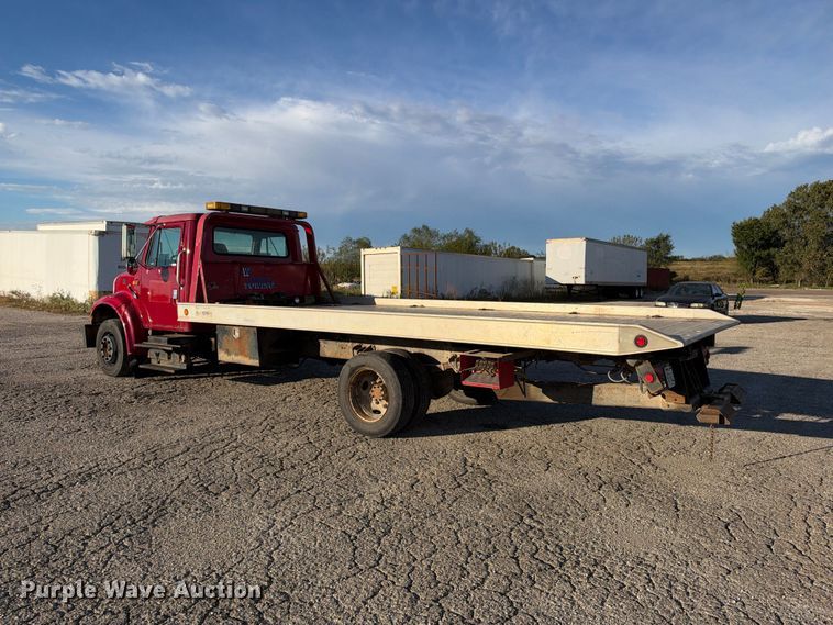 image for item EX1496 1997 International 4700 rollback truck