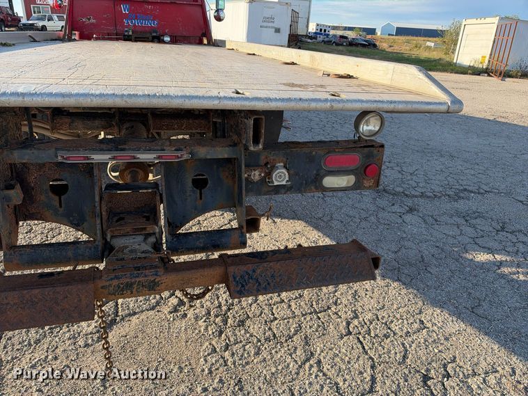 image for item EX1496 1997 International 4700 rollback truck