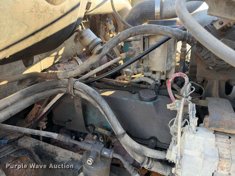 image for item EX1496 1997 International 4700 rollback truck