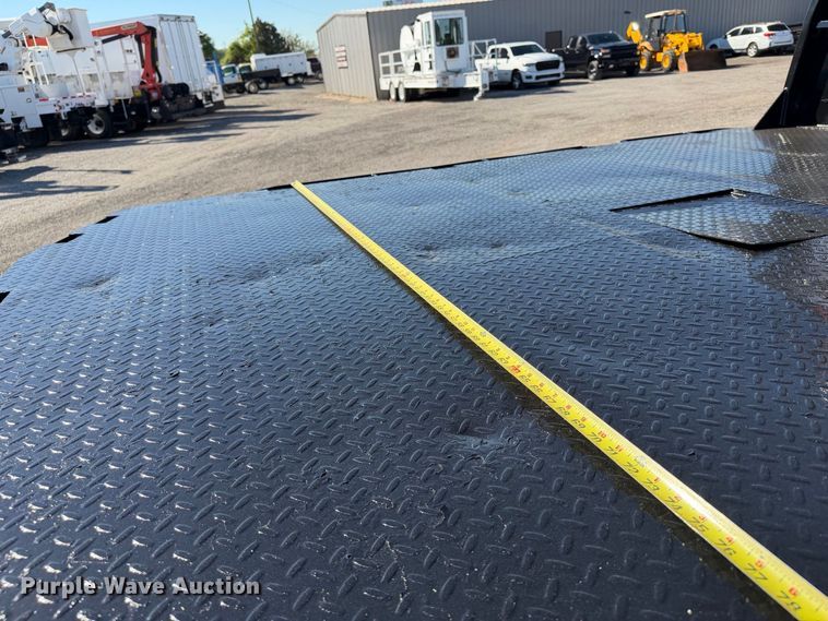 image for item FW3531 2022 RAM 5500 Crew Cab flatbed truck