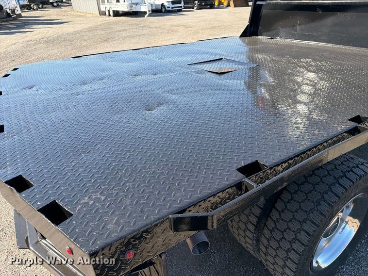 image for item FW3531 2022 RAM 5500 Crew Cab flatbed truck