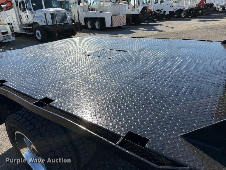 image for item FW3531 2022 RAM 5500 Crew Cab flatbed truck