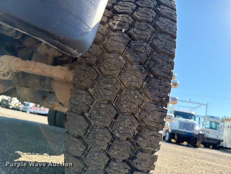 image for item FW3531 2022 RAM 5500 Crew Cab flatbed truck