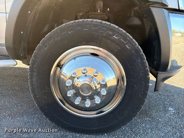 image for item FW3531 2022 RAM 5500 Crew Cab flatbed truck