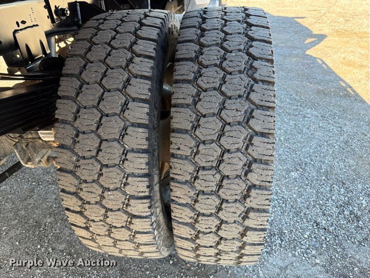 image for item FW3531 2022 RAM 5500 Crew Cab flatbed truck
