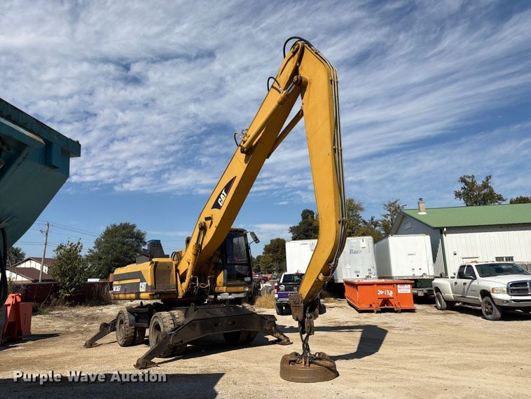 image for item FK3834 1999 Caterpillar M320 wheeled excavator