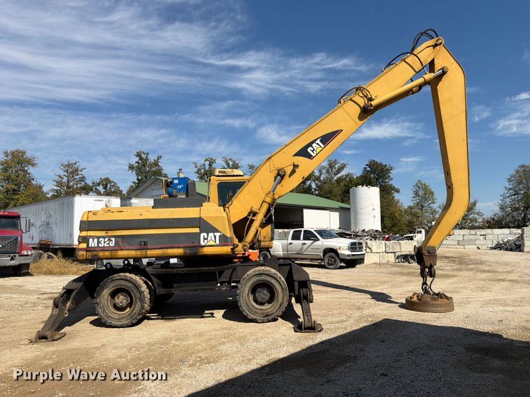image for item FK3834 1999 Caterpillar M320 wheeled excavator