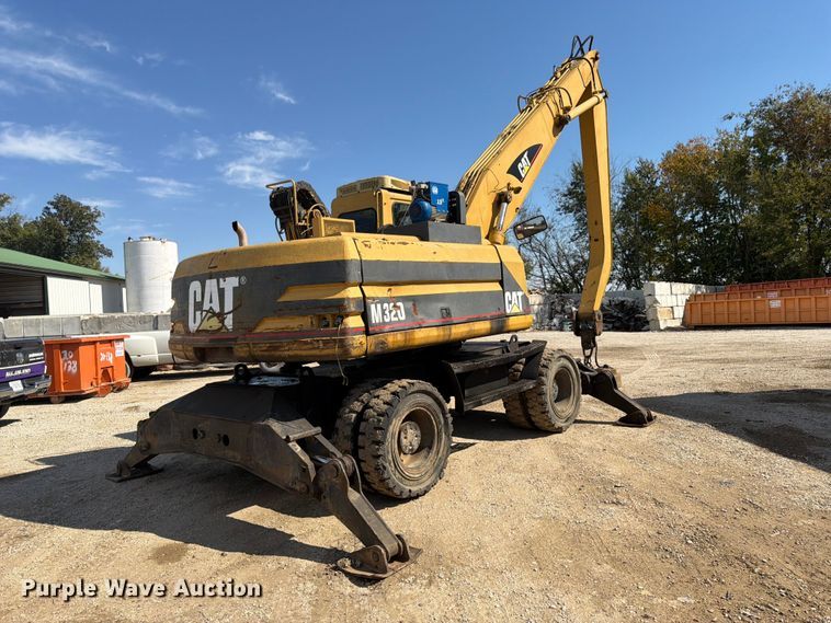image for item FK3834 1999 Caterpillar M320 wheeled excavator