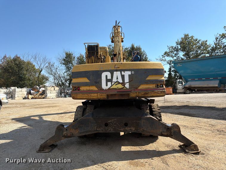 image for item FK3834 1999 Caterpillar M320 wheeled excavator