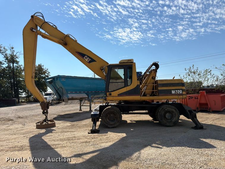 image for item FK3834 1999 Caterpillar M320 wheeled excavator